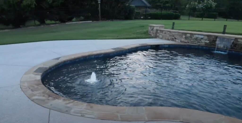 J&M Pool Company: Luxe Freeform Pool with Pebbletec & Flagstone Detailing